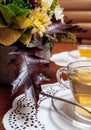 ÃÂ¡up of tea and flowers on table